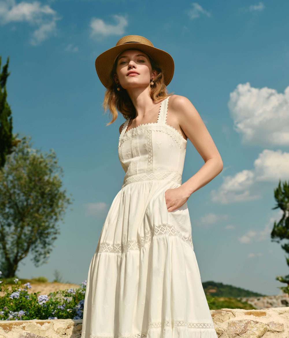 Female model wearing Petite Studio dress in the South of France against cloudy sky